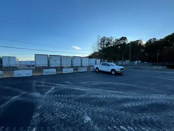 Commercial lot enclosed with galvanized chain link fence