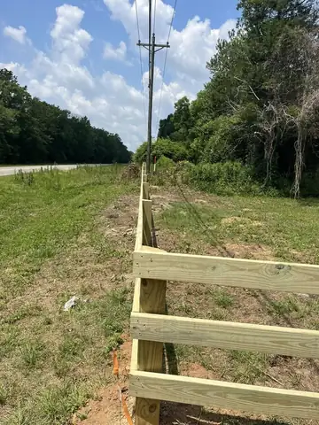 Rail fence going in on cleared rural ground
