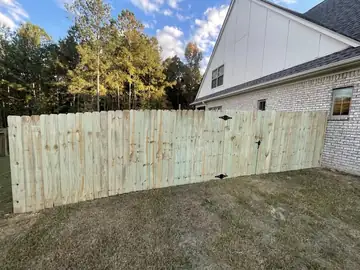 Wood privacy fence along a rear lot line