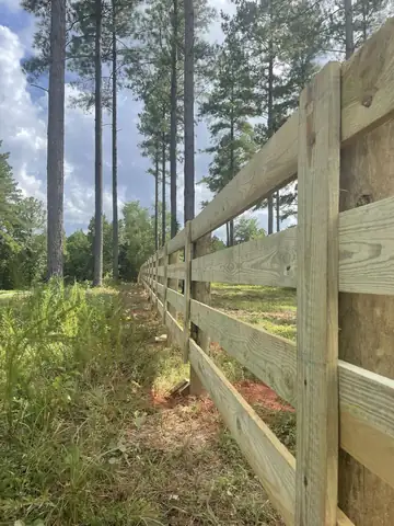 Wooden post and rail fence in Alabama pine woods