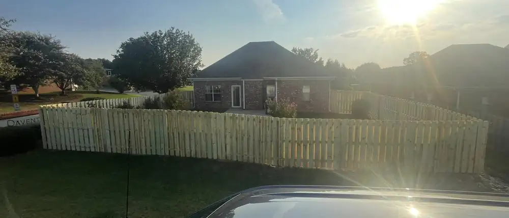 Wood fence at dusk behind an Alabama home