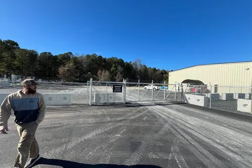 Drive gates and perimeter fence at a commercial storage facility