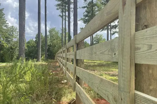 Wooden post and rail fence in Alabama pine woods